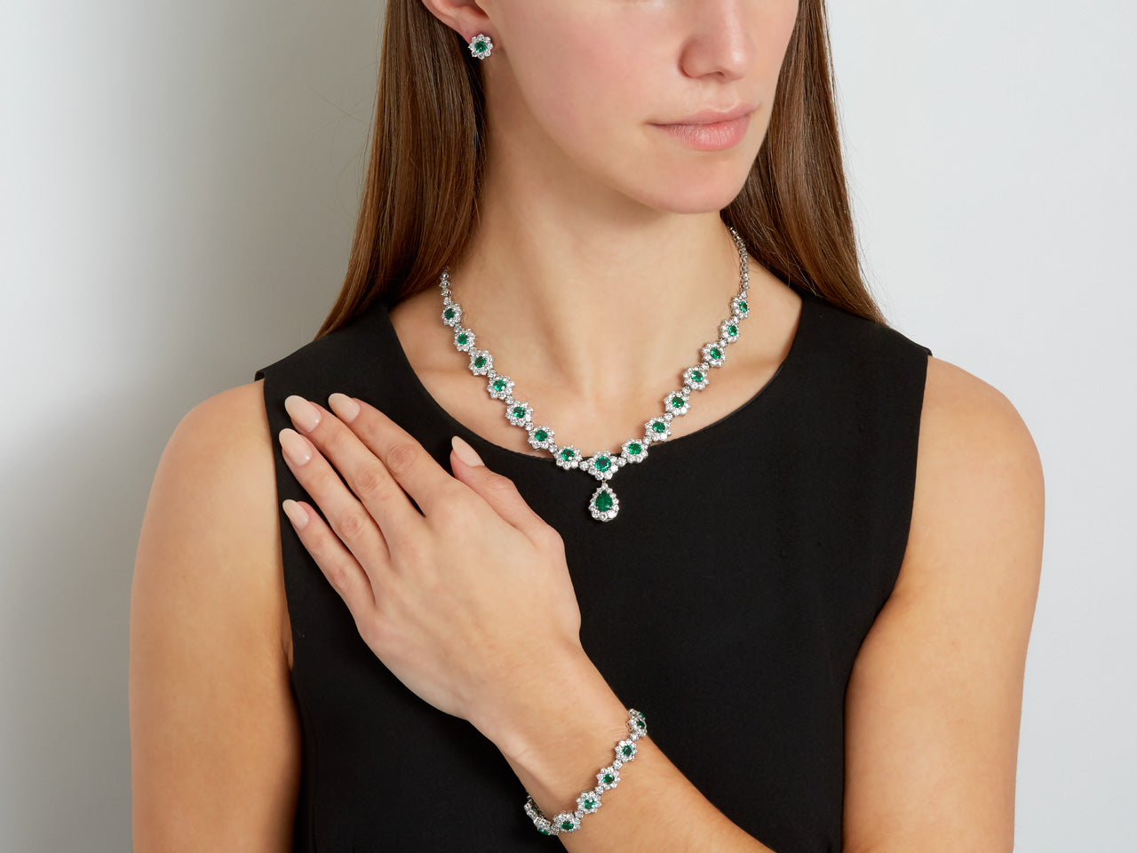 Suite of Emerald and Diamond Cluster Necklace, Bracelet and Earrings in Platinum